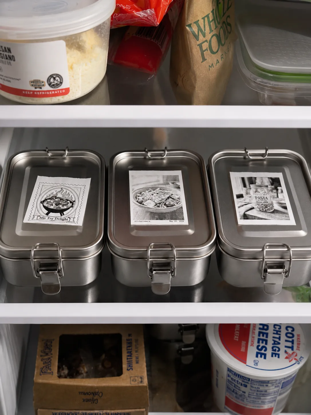Food prep containers labeled with custom illustrated stickers